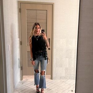 Elegant Black Sleeveless Top with Circle Accents